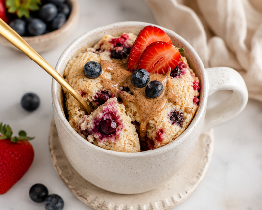 Fluffy vegan berry mug cake topped with strawberries and blueberries made with Holly’s Pantastic Pancake Mix. Dairy-free, egg-free, soy-free microwave mug cake made with real fruit ingredients.